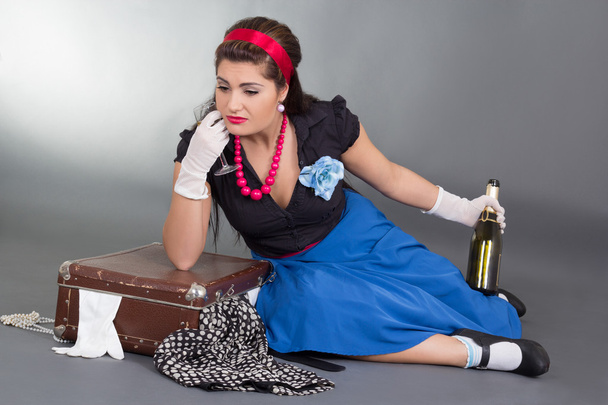 drunk pinup girl with bottle of champagne - Photo, Image