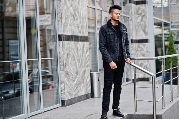 Handsome and fashionable indian man in black jeans jacket posed outdoor. - Valokuva, kuva