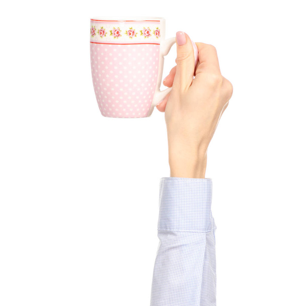 Cup mug pink flower print in hand arm raised up - 写真・画像