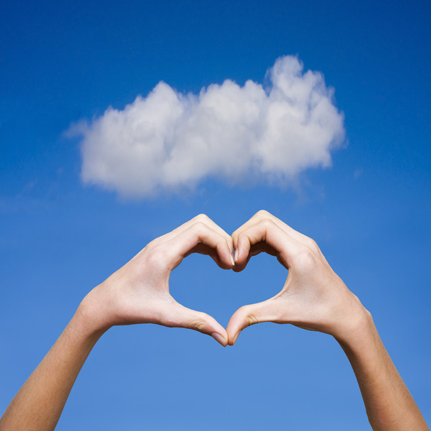clasped hands forming a heart with natural background - Photo, Image