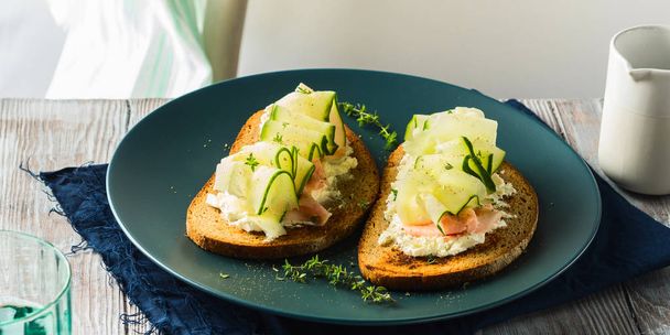 Rye bread toasts with cheese, ham, cucumber - Photo, Image
