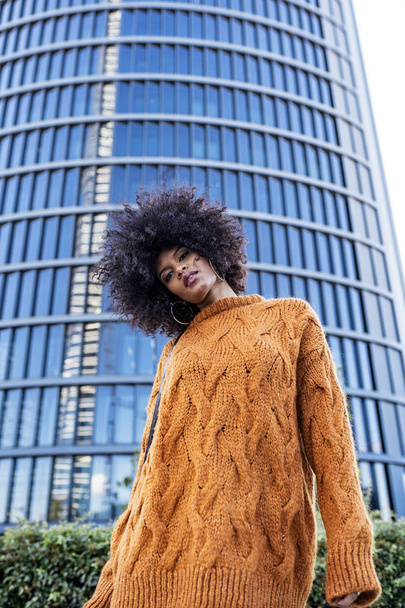 Portrait of attractive afro woman in the street. Hair style concept - Foto, Bild