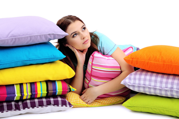 Beautiful young girl with pillows isolated on whit - Foto, Imagem