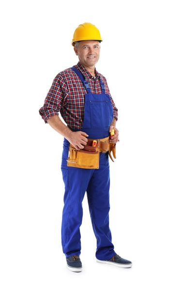 Electrician with tools wearing uniform on white background - Фото, изображение