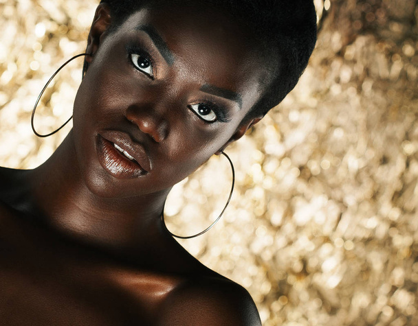 Stunning Portrait of an African American Black Woman over golden background - Fotoğraf, Görsel