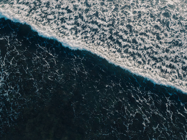 Aerial view beautiful of sea waves from drone. Stock image picture of blue color ocean water, wave, sea surface. Top view on turquoise waves, clear water surface texture. Top view, amazing nature background - Zdjęcie, obraz