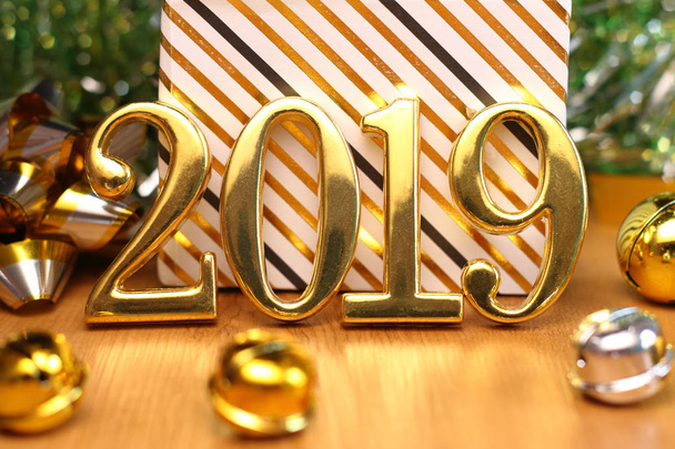 2019 gold numbers text and decoration. New year is the first day of the year in the Gregorian calendar. - Photo, Image