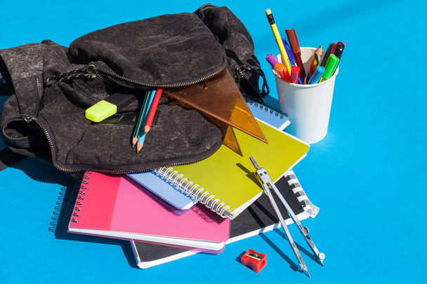 Backpack with school supplies - notebooks, penciles, divider, pencil sharpener and ruler - Fotografie, Obrázek