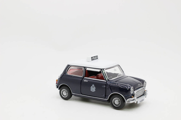 a scale of Mini Cooper with figure  - Photo, Image