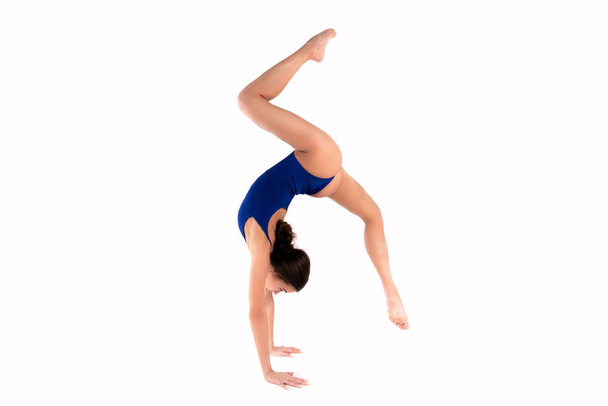 Beautiful young flexible girl splits stretch workout - Fotoğraf, Görsel