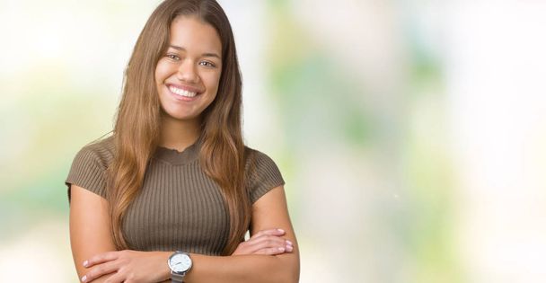 Young beautiful brunette woman over isolated background happy face smiling with crossed arms looking at the camera. Positive person. - Photo, Image
