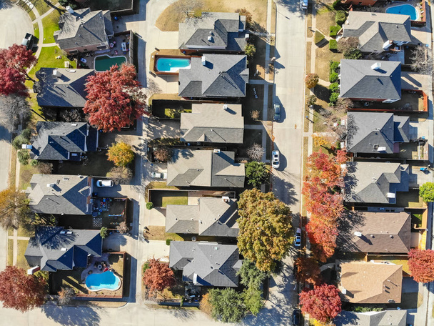 Top view residential houses with swimming pool and colorful fall foliage suburban Dallas, Texas, USA. Straight down look as satellite style. - Photo, Image