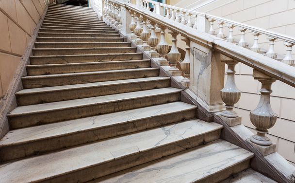 An old open stone staircase. Stone, marble steps of old staircase with traces of  destruction. An ancient marble staircase, ancient broken worn steps. old majestic, grandiose, marble stone staircase - Photo, Image