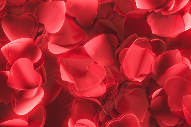 beautiful decorative red heart shaped petals, valentines day background - Fotó, kép