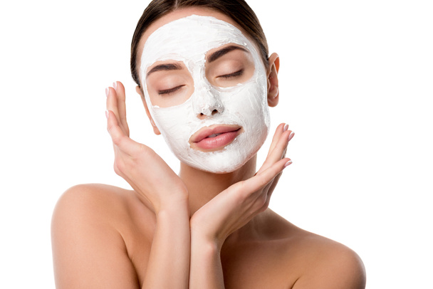 beautiful nude woman with facial skin care mask and eyes closed isolated on white - Фото, изображение