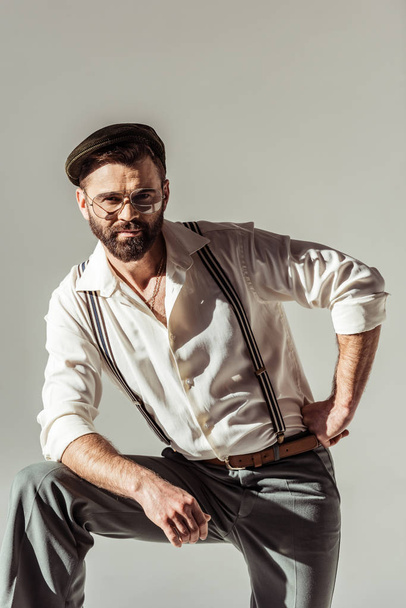bearded stylish man in cap looking at camera isolated on grey - Φωτογραφία, εικόνα
