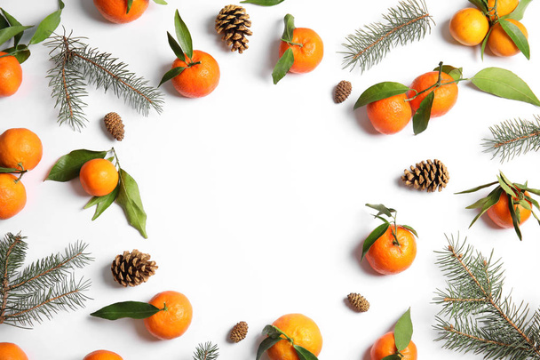 Christmas composition with ripe tangerines and space for text on white background, flat lay - Foto, Imagem