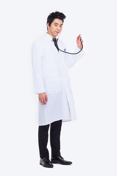 Young Asian doctor using stethoscope - Photo, Image