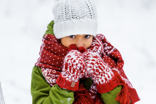 cute african american child in warm clothing at white background - Photo, Image
