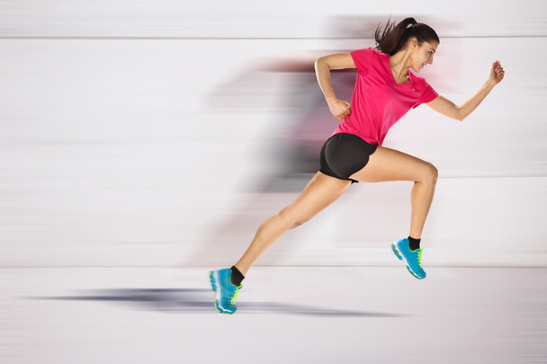 sport woman starting running. Speed effect. - Фото, изображение