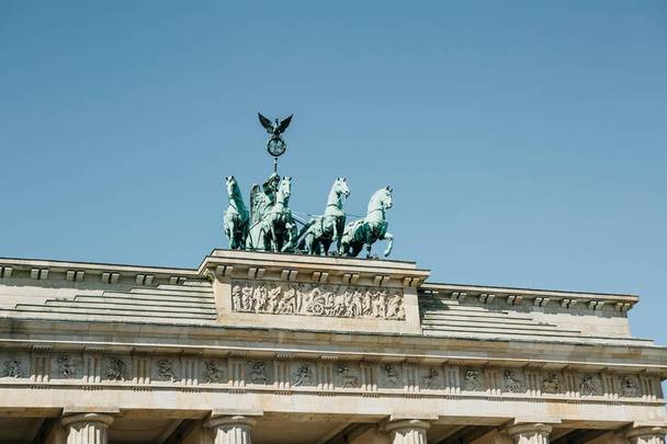 Closeup of the Brandenburg Gate against the blue sky. - Фото, изображение