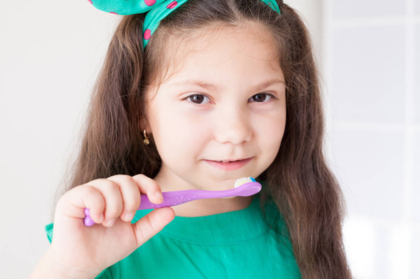 little girl brushing his teeth with a toothbrush tooth fell dentistry - Photo, Image