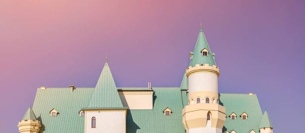 Roof part of fairy tail castle against blue sky on background. - 写真・画像