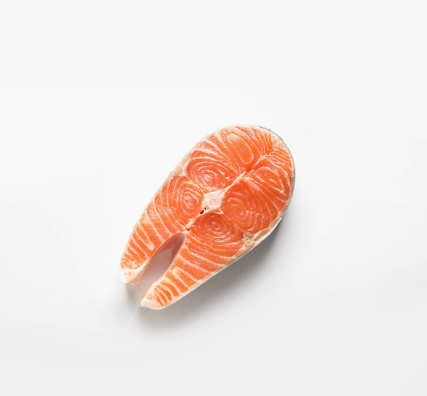 Raw salmon steak on white background, top view. Natural food high in protein - Foto, immagini