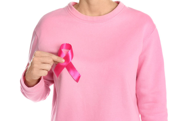 Woman holding pink ribbon on white background, closeup. Breast cancer awareness - Foto, immagini