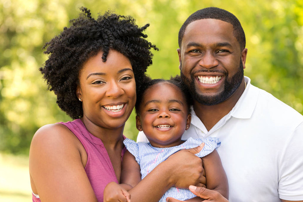 Happy African American family laughing and smiling. - Photo, image