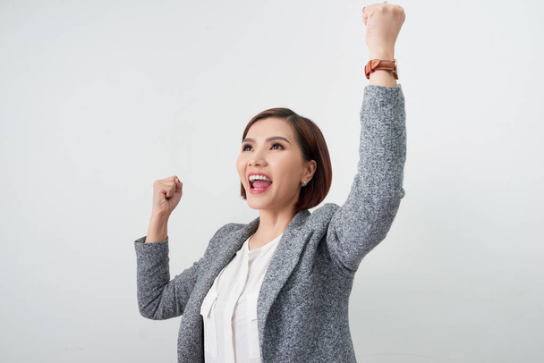 happy excited businesswoman with hands up on white background - Photo, Image