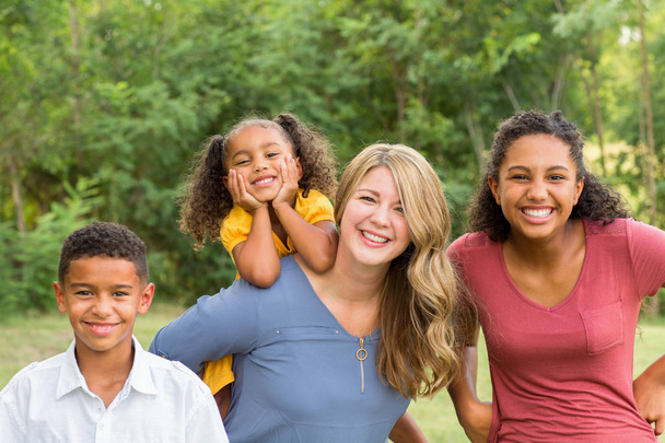 Portarit of a happy mixed race family smiling - Photo, Image