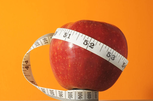 Diet Apple and Meter on a Colored Background - Photo, Image