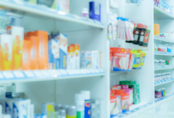 Blurred picture of medicine shelf in drug store. Pharmacy shop interiors. Pharmaceutical products in drugstore. Medical retail shop. Pharmacy in hospital. Healthcare business. Drug display shelf. - Photo, Image