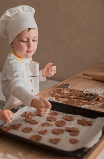 Baby Makes Christmas Cookies. Culinary Concept. Christmas Cooking. Children - Фото, изображение