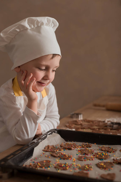 Baby Makes Christmas Cookies. Culinary Concept. Christmas Cooking. Children - 写真・画像