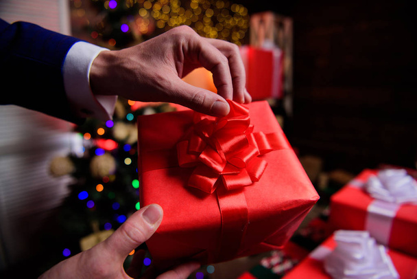 Prepare for christmas and new year. Magic moments. Gift boxes with big ribbon bow close up. Red wrapped gifts or presents. Wrapping gifts concept. Prepare surprise gifts for family and friends - Foto, Imagem