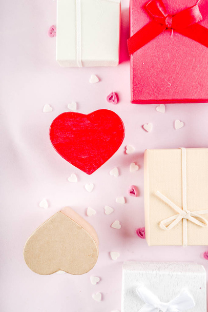 Valentines day gifts boxes background, frame for holiday greeting card background, with confetti  candy hearts, flat lay, top view, copy space - Φωτογραφία, εικόνα
