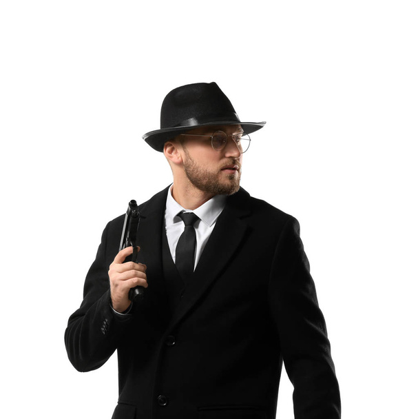 Detective with gun on white background - Fotó, kép