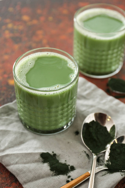 Glasses of healthy spirulina drink on table - Foto, Imagen