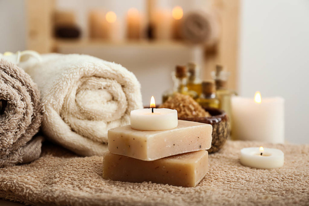 Beautiful spa composition with soap and candles on table - Foto, imagen