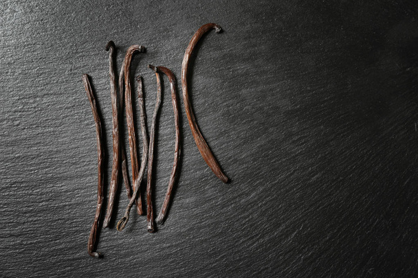 Aromatic vanilla sticks on dark background - Photo, Image