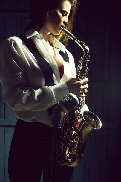 retro woman with saxophone - Zdjęcie, obraz
