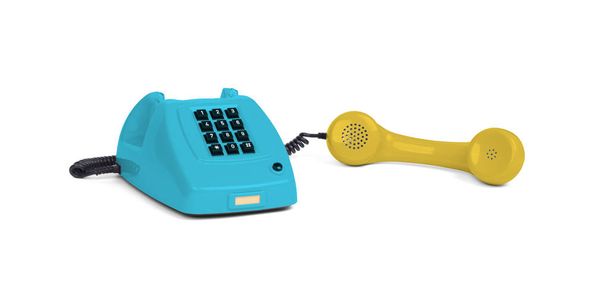 Vintage multi gekleurde telefoon met een witte achtergrond - Foto, afbeelding