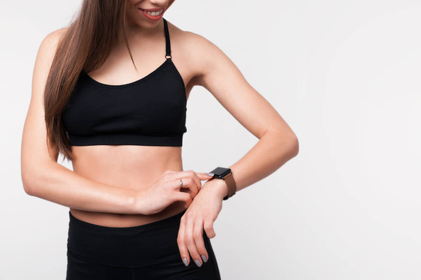  Activity tracker on a woman's wrist, fitness girl touching her smart watch. - Fotoğraf, Görsel