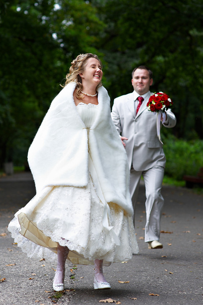 Groom runs after the bride - Photo, image