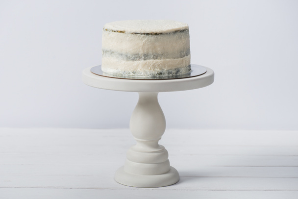 cake on white stand isolated on white - Photo, Image
