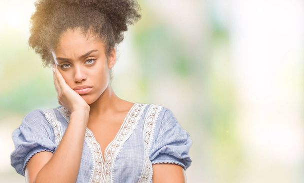Young afro american woman over isolated background thinking looking tired and bored with depression problems with crossed arms. - Фото, изображение