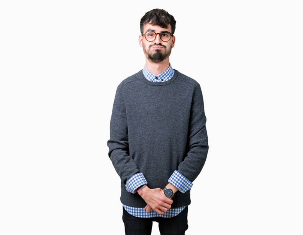 Young handsome smart man wearing glasses over isolated background puffing cheeks with funny face. Mouth inflated with air, crazy expression. - Photo, Image