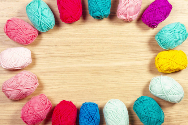 Colorful yarn for knitting on wooden background - Photo, Image